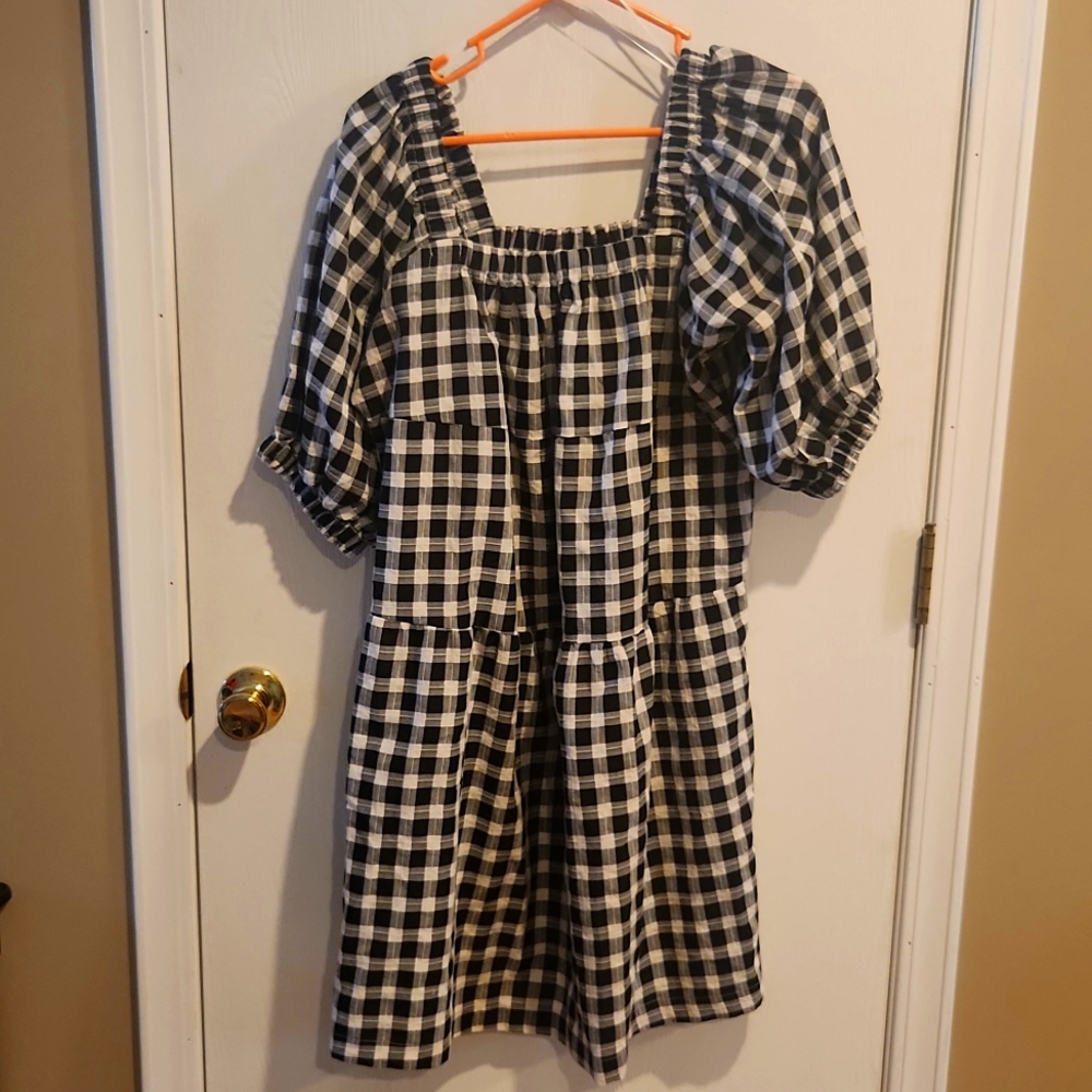 Black and cream checked dress with puffed sleeves